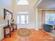Inviting foyer with hardwood floors, natural light, and stylish decor at 4763 River Hills Dr, Denver, NC 28037