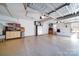 Spacious garage with epoxy flooring, built-in storage cabinets, and ample room for vehicles and projects at 4763 River Hills Dr, Denver, NC 28037