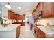 Spacious kitchen boasts granite counters, stainless appliances, and beautiful wood cabinetry at 4763 River Hills Dr, Denver, NC 28037