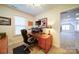 Cozy home office with a wooden desk, comfortable chair, and ample natural light at 4763 River Hills Dr, Denver, NC 28037