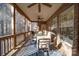 Screened patio with a ceiling fan and dining table at 4763 River Hills Dr, Denver, NC 28037