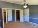 Spacious bedroom featuring carpet, multiple closets, and a ceiling fan at 485 Harper Miller Dr, Cleveland, NC 27013