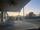 Relaxing front porch featuring classic rocking chairs and a serene view of the surrounding landscape at 485 Harper Miller Dr, Cleveland, NC 27013