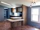 Kitchen featuring bar seating, updated lighting, laminate countertops and wood cabinets at 485 Harper Miller Dr, Cleveland, NC 27013