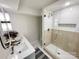 This bathroom showcases a sleek glass shower and a double vanity with contemporary lighting at 5057 Murrayhill Rd, Charlotte, NC 28210