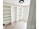 Organized walk-in closet featuring custom shelving and ample storage space to keep your wardrobe tidy at 5057 Murrayhill Rd, Charlotte, NC 28210