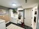 Bright laundry room with storage cabinets, butcher block bench, and modern decor at 5057 Murrayhill Rd, Charlotte, NC 28210
