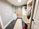 Spacious laundry room with white cabinets, wainscoting, and tile floor at 5057 Murrayhill Rd, Charlotte, NC 28210