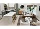 Open concept living space with kitchen island, modern furnishings, and decorative rug at 5057 Murrayhill Rd, Charlotte, NC 28210