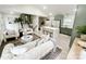 Open concept living and kitchen with island, neutral paint colors, and wood floors at 5057 Murrayhill Rd, Charlotte, NC 28210
