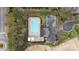 Aerial view of a community pool with parking and surrounding nature, offering a relaxing and convenient amenity at 518 Streamside Ln, Marvin, NC 28173