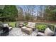 Relaxing back deck with seating, an outdoor rug, and views of the backyard at 518 Streamside Ln, Waxhaw, NC 28173