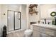 Bathroom with tiled floors, walk-in shower, and decorative shelves at 518 Streamside Ln, Marvin, NC 28173