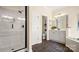 Modern bathroom with a glass shower, toilet, and vanity with gray cabinets at 518 Streamside Ln, Marvin, NC 28173