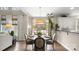 Charming dining area with a wooden table, stylish chairs, and an open view to the outdoor living space at 518 Streamside Ln, Marvin, NC 28173
