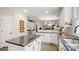 Spacious kitchen featuring stainless steel appliances, a center island, and granite countertops at 518 Streamside Ln, Marvin, NC 28173