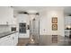 Modern kitchen featuring stainless steel appliances, ample cabinet space, and sleek granite countertops at 518 Streamside Ln, Marvin, NC 28173