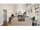 Bright living room features a fireplace, hardwood floors, and large windows at 518 Streamside Ln, Marvin, NC 28173