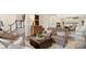 Inviting living room with hardwood floors, comfortable seating, and a seamless flow to the dining area and staircase at 518 Streamside Ln, Marvin, NC 28173