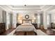 Spacious main bedroom features trey ceilings and stylish furnishings at 518 Streamside Ln, Marvin, NC 28173