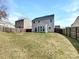 Spacious backyard with a wood fence offers plenty of room for outdoor activities and relaxation at 5810 Dove Point Sw Dr, Concord, NC 28025