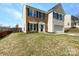 Charming two-story home with a brick front, black shutters, and a well-maintained lawn at 5810 Dove Point Sw Dr, Concord, NC 28025