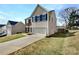 Charming two-story home boasts a two-car garage and a well-manicured lawn and driveway at 5810 Dove Point Sw Dr, Concord, NC 28025