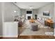 Bright living room features stylish furniture, a cozy fireplace, and a large area rug at 5810 Dove Point Sw Dr, Concord, NC 28025
