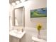 Bright bathroom featuring a pedestal sink, modern fixtures, and a decorative painting at 6016 Dogwood Blvd, Kannapolis, NC 28081