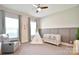 Bedroom featuring a cozy gray chair, crib, tipi tent and two large windows at 6016 Dogwood Blvd, Kannapolis, NC 28081
