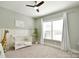 Bedroom featuring a white crib, giraffe, and tree. Plenty of natural light fills the room at 6016 Dogwood Blvd, Kannapolis, NC 28081