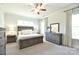 Comfortable bedroom with neutral color scheme and natural light, featuring an ceiling fan and matching furniture set at 6016 Dogwood Blvd, Kannapolis, NC 28081