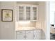 Convenient butler's pantry with granite countertop, custom cabinets, and modern backsplash, adjacent to dining area at 6016 Dogwood Blvd, Kannapolis, NC 28081