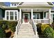 Inviting front porch with stone stairs leading to a covered entrance, perfect for a warm welcome at 6016 Dogwood Blvd, Kannapolis, NC 28081