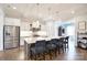 Bright kitchen features a large island, stainless steel appliances and stylish pendant lighting at 6016 Dogwood Blvd, Kannapolis, NC 28081