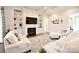 Bright living room with a fireplace, built-in shelving, and comfortable seating at 6016 Dogwood Blvd, Kannapolis, NC 28081