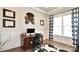 Home office with a wooden desk, neutral decor, and a window for natural light at 6016 Dogwood Blvd, Kannapolis, NC 28081