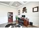 Well-lit office space featuring a wooden desk and a decorative wall hanging at 6016 Dogwood Blvd, Kannapolis, NC 28081