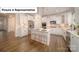 Bright kitchen featuring a large center island, stainless steel appliances, and ample cabinet space at 7015 Sylvan Retreat Dr, Denver, NC 28037