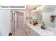 This bathroom includes a double vanity with sleek hardware and a separate shower and tub at 7021 Sylvan Retreat Dr, Denver, NC 28037