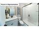 This bathroom features a walk-in shower, attractive vanity and stylish tile flooring at 7021 Sylvan Retreat Dr, Denver, NC 28037
