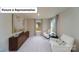 The bright room is well-lit with natural light and includes comfortable seating at 7021 Sylvan Retreat Dr, Denver, NC 28037