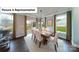 Bright dining area with hardwood floors, large windows, and views of the backyard at 7021 Sylvan Retreat Dr, Denver, NC 28037