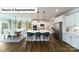 Open-concept kitchen featuring a central island with seating and stainless steel appliances at 7021 Sylvan Retreat Dr, Denver, NC 28037