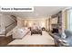 Cozy living room featuring a fireplace, hardwood floors, and an open layout at 7021 Sylvan Retreat Dr, Denver, NC 28037