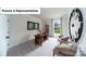 Stylish home office with natural light, modern decor, and comfortable seating at 7021 Sylvan Retreat Dr, Denver, NC 28037