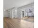 Bright living room featuring wood floors and sliding glass doors to the back patio at 7415 Mystic Ln, Charlotte, NC 28227