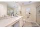 Bathroom featuring vanity, neutral tile floor, and glass enclosed shower at 9018 Seamill Rd, Charlotte, NC 28278