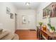 Bright foyer with hardwood floors, a console table, and a decorated wall at 9018 Seamill Rd, Charlotte, NC 28278