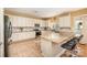 Spacious kitchen with white cabinets, granite countertops, and stainless steel appliances at 9018 Seamill Rd, Charlotte, NC 28278